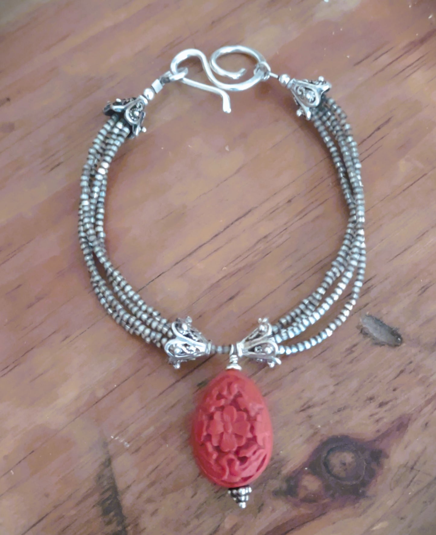 B811 Debra Saldivar - Bracelet, Japanese Seed Beads, Bali Silver, Hand Tooled Sterling Hook, Carved Cinnebar