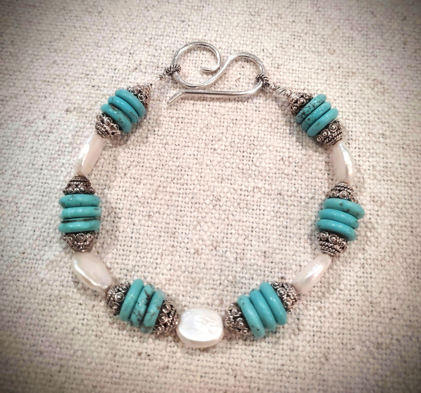 B853 Debra Saldivar - Bracelet, Turquoise discs, Ivory Freshwater Pearl Ovals, Hand Tooled Sterling Silver Closure, Bali Silver