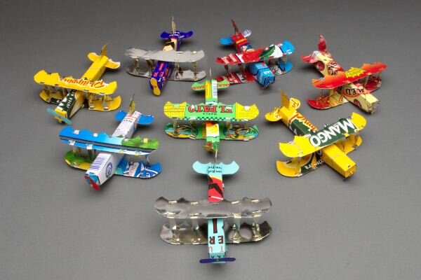 Loran Scruggs - Recycled Tin Art Airplanes